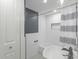 Clean bathroom with white subway tile and shower/tub combo at 1428 Illinois Ave, Palm Harbor, FL 34683