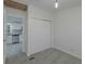 Bedroom with grey carpet and view of kitchen at 1428 Illinois Ave, Palm Harbor, FL 34683