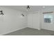 Spacious bedroom with grey carpet and double closet at 1428 Illinois Ave, Palm Harbor, FL 34683