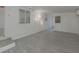 Bright Florida room with grey flooring and white walls at 1428 Illinois Ave, Palm Harbor, FL 34683