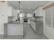 Modern kitchen with concrete countertops and white shaker cabinets at 1428 Illinois Ave, Palm Harbor, FL 34683