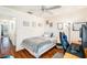 Cozy bedroom featuring a bed, desk, and hardwood floors at 2066 Sun Down Dr 2066 Sun Down Dr, Clearwater, FL 33763