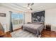 Main bedroom with ceiling fan and mountain tapestry at 2066 Sun Down Dr 2066 Sun Down Dr, Clearwater, FL 33763