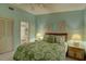 Bedroom with a queen bed, ensuite bath access, and closet at 4452 Weybridge St # 74, Sarasota, FL 34235