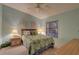 Cozy bedroom with double bed and window coverings at 4452 Weybridge St # 74, Sarasota, FL 34235