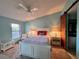 Cozy bedroom with a queen-size bed and access to bathroom at 4452 Weybridge St # 74, Sarasota, FL 34235