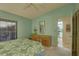 Spacious bedroom with a dresser and view of kitchen at 4452 Weybridge St # 74, Sarasota, FL 34235