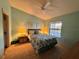 Comfortable bedroom with a queen bed and ceiling fan at 4452 Weybridge St # 74, Sarasota, FL 34235