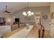 Dining area with wood table and chairs near living room and bathroom at 4452 Weybridge St # 74, Sarasota, FL 34235