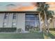 Building exterior showcasing screened balcony at 4452 Weybridge St # 74, Sarasota, FL 34235