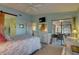 Main bedroom with sliding doors to the patio and a view at 4452 Weybridge St # 74, Sarasota, FL 34235