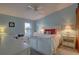 Bright bedroom with a comfortable bed, built-in desk and access to the bathroom at 4452 Weybridge St # 74, Sarasota, FL 34235