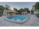 Community pool with shaded seating and plenty of lounge chairs at 4452 Weybridge St # 74, Sarasota, FL 34235