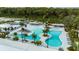 Aerial view of community pool and surrounding amenities at 10876 Ibis Brook Ct, Land O Lakes, FL 34638