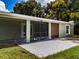 Home features a screened-in patio and concrete slab at 11224 Inglewood Dr, Gibsonton, FL 33534