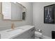 Modern bathroom with gray vanity, quartz countertop, and gold accents at 1308 W Plymouth St, Tampa, FL 33603