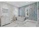 Elegant bathroom with soaking tub and marble tile at 1308 W Plymouth St, Tampa, FL 33603