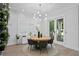 Bright dining room with a round wooden table and six chairs at 1308 W Plymouth St, Tampa, FL 33603