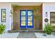 Stylish double blue front doors with wood accents and potted plants at 1308 W Plymouth St, Tampa, FL 33603