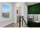 Bright hallway with a view into a small bathroom and a staircase at 1308 W Plymouth St, Tampa, FL 33603