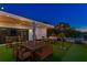 Evening view of rooftop terrace with string lights and outdoor furniture at 1308 W Plymouth St, Tampa, FL 33603