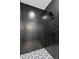 Stylish black and white geometric tile shower at 1308 W Plymouth St, Tampa, FL 33603