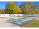 Inviting swimming pool with stone pavers and a basketball hoop at 1308 W Plymouth St, Tampa, FL 33603