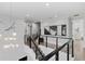 Modern upper hall with stylish light fixture and railing at 1308 W Plymouth St, Tampa, FL 33603