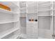 Organized walk-in closet with custom shelving, drawers, and ample storage space at 17977 Grand Prosperity Dr, Venice, FL 34293