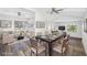 Open concept dining area with stylish furniture and hardwood floors at 4901 W Bartlett Dr, Tampa, FL 33603