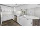 Modern kitchen with white cabinets, quartz counters and island at 4901 W Bartlett Dr, Tampa, FL 33603