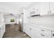 Modern white kitchen with stainless steel appliances at 4901 W Bartlett Dr, Tampa, FL 33603