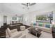 Virtually staged living room featuring hardwood floors and comfy furniture at 4901 W Bartlett Dr, Tampa, FL 33603