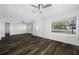 Bright living room with hardwood floors and large window at 4901 W Bartlett Dr, Tampa, FL 33603