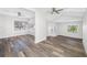 Bright living room with hardwood floors and large windows at 4901 W Bartlett Dr, Tampa, FL 33603