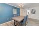 Cozy dining area features wood-look flooring and a modern light fixture at 5110 28Th W St, Bradenton, FL 34207