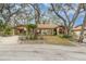 Charming single-story home featuring a covered carport, mature trees, and well-maintained landscaping at 5110 28Th W St, Bradenton, FL 34207