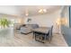 Bright living area with wood-look floors connecting the living and dining spaces with lots of natural light at 5110 28Th W St, Bradenton, FL 34207