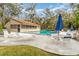 Community pool with lounge chairs, tables and umbrellas at 5110 28Th W St, Bradenton, FL 34207