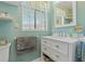 Clean bathroom with white vanity and a large mirror at 1957 Temple Ter, Clearwater, FL 33764