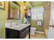 Bathroom with dark vanity and a bathtub at 1957 Temple Ter, Clearwater, FL 33764