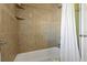 Clean bathroom with a bathtub and shower at 1957 Temple Ter, Clearwater, FL 33764