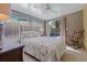 Bedroom with a full bed and access to patio at 1957 Temple Ter, Clearwater, FL 33764