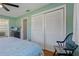 Bright bedroom with a queen bed, and built-in closet at 1957 Temple Ter, Clearwater, FL 33764