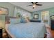 King-size bedroom with ensuite bathroom and hardwood floors at 1957 Temple Ter, Clearwater, FL 33764