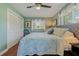 Spacious bedroom with ceiling fan and large closet at 1957 Temple Ter, Clearwater, FL 33764