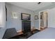 Bedroom with a dresser and large TV at 1957 Temple Ter, Clearwater, FL 33764
