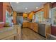 Updated kitchen with granite countertops, stainless steel appliances, and wood cabinets at 1957 Temple Ter, Clearwater, FL 33764