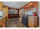 Updated kitchen with granite countertops, stainless steel appliances, and wood cabinets at 1957 Temple Ter, Clearwater, FL 33764