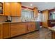 Updated kitchen with granite countertops, stainless steel appliances, and wood cabinets at 1957 Temple Ter, Clearwater, FL 33764